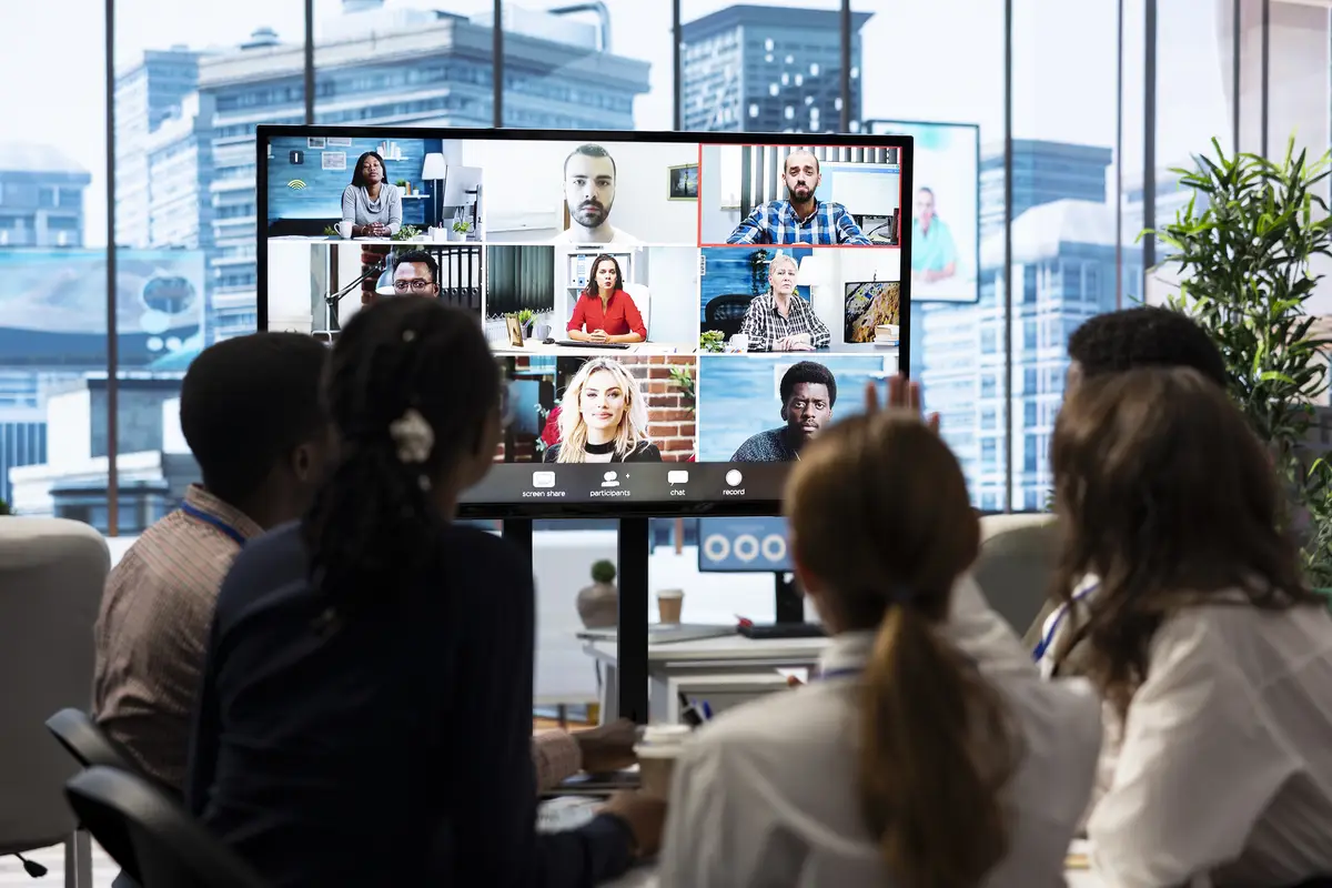Executive board members discussing with shareholders on online videocall