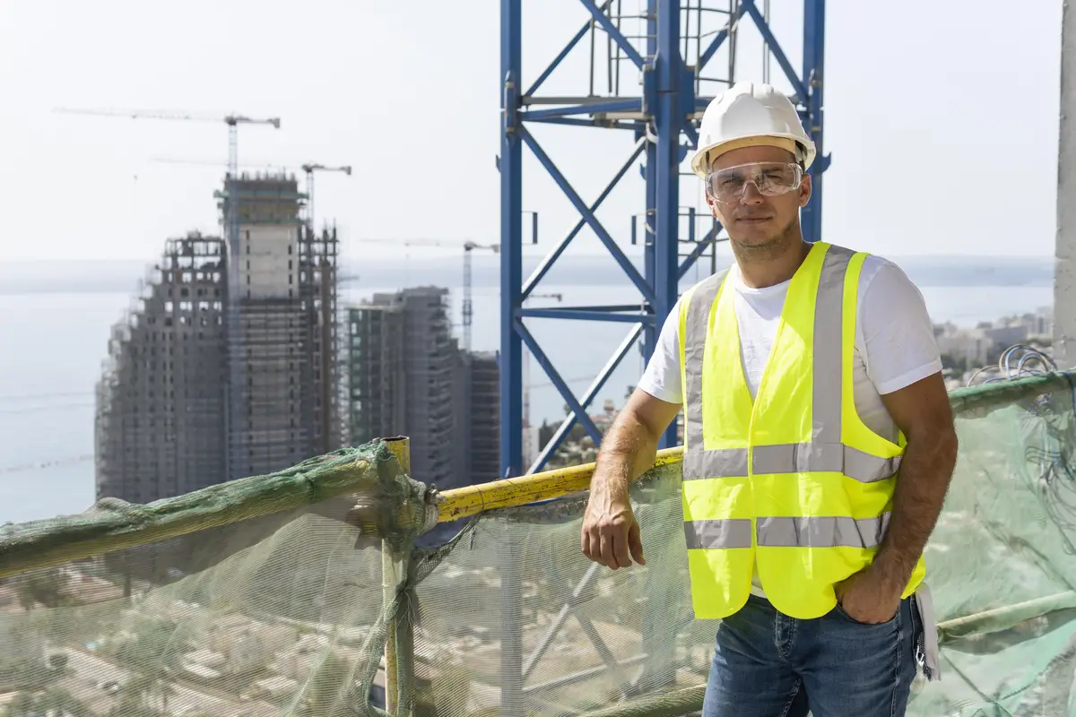 Outdoor construction worker standing at high altitude
