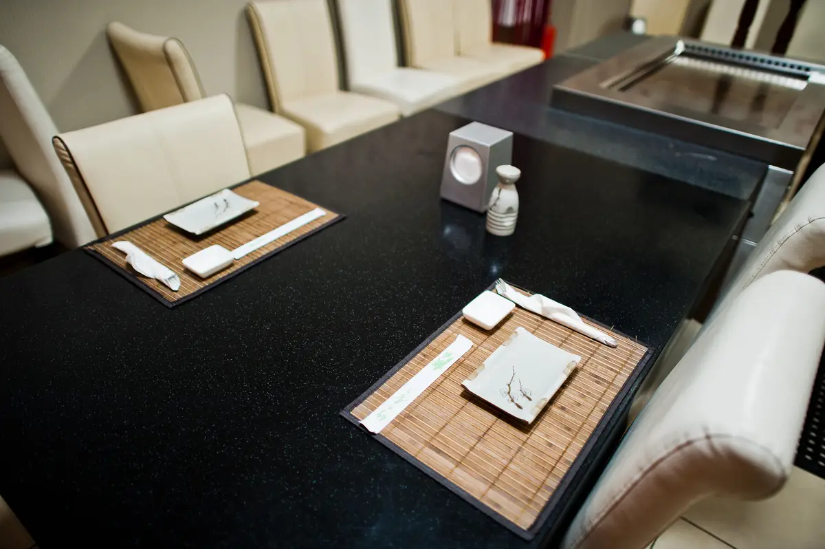 Catered table in asian restaurant Chopsticks and soy sauce