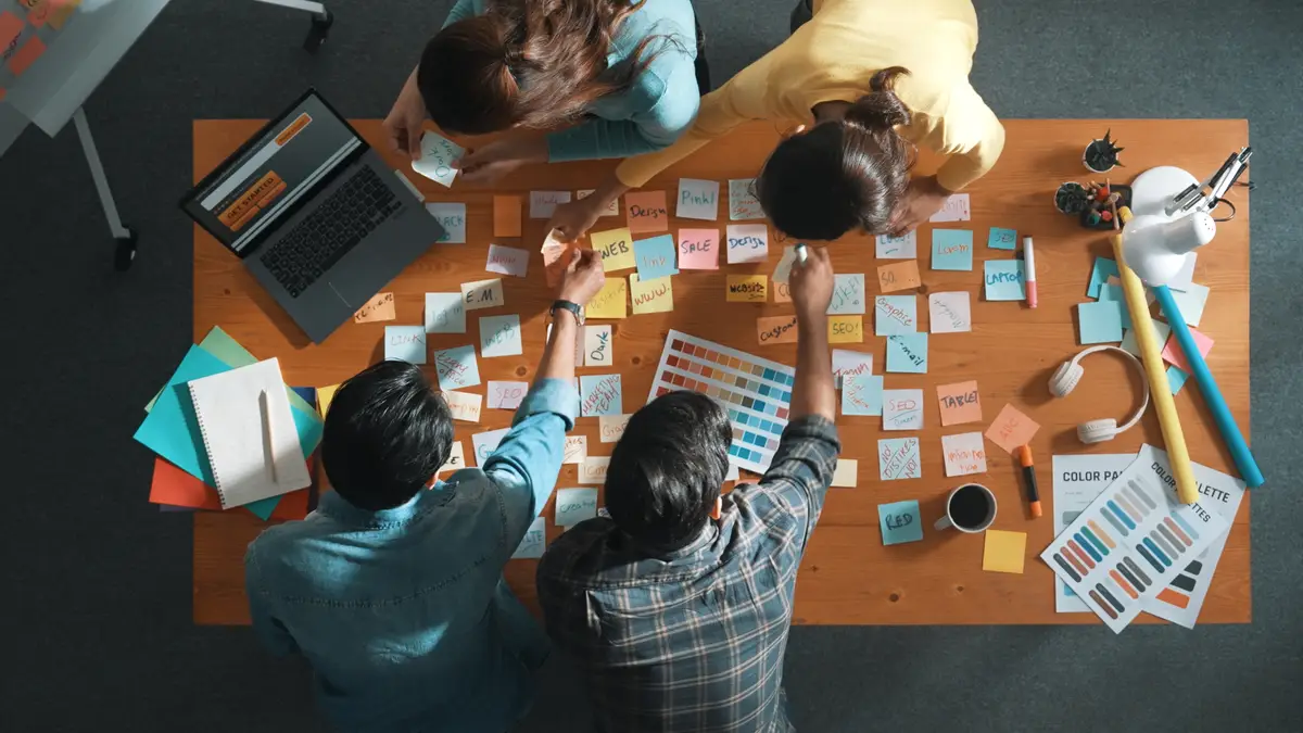 Time lapse of business team looking laptop screen and sharing idea Symposium