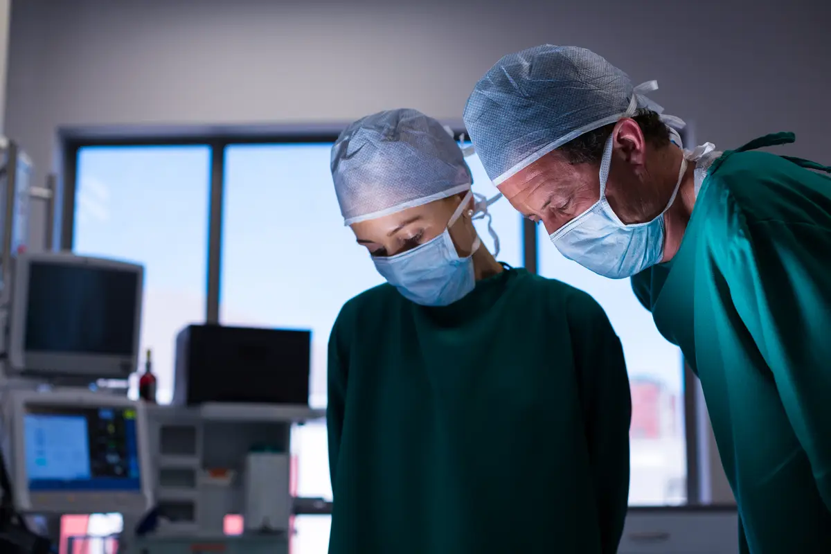 Surgeons performing operation in operation theater