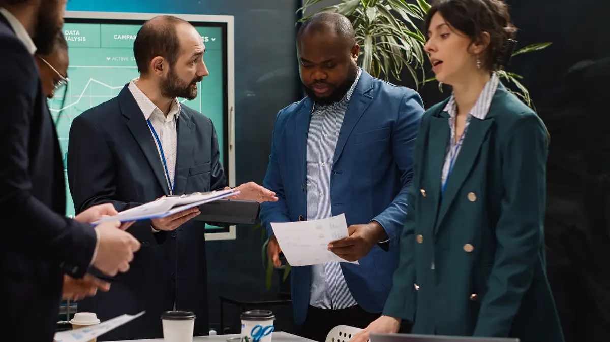 Startup colleagues reviewing data to improve customer satisfaction and retention