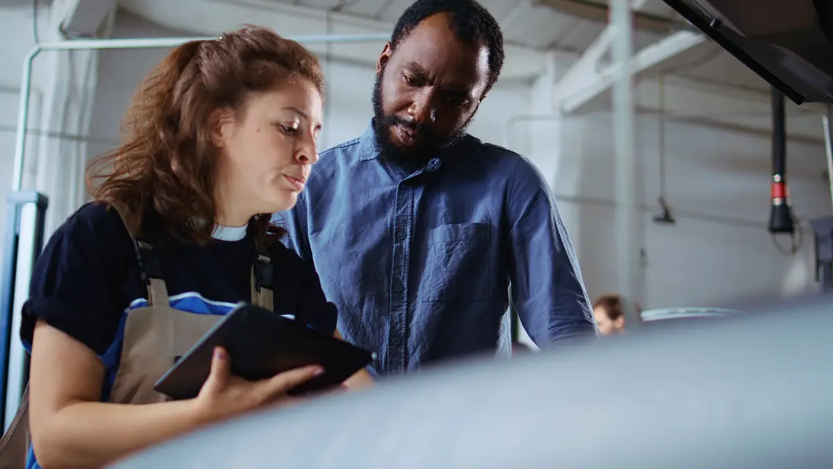 Serviceman does checkup on client car