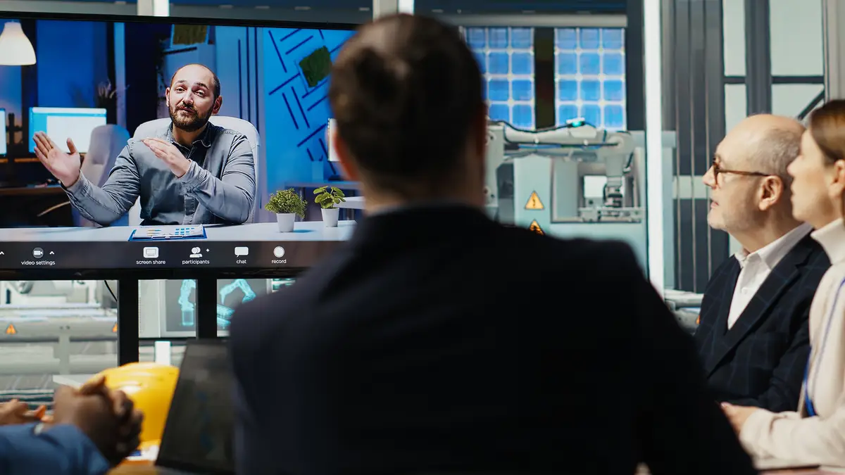 Experts optimize factory equipment energy output during videocall meeting