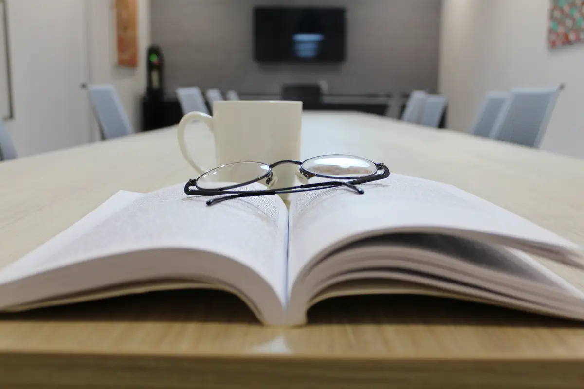 Close-up of open book on table at home