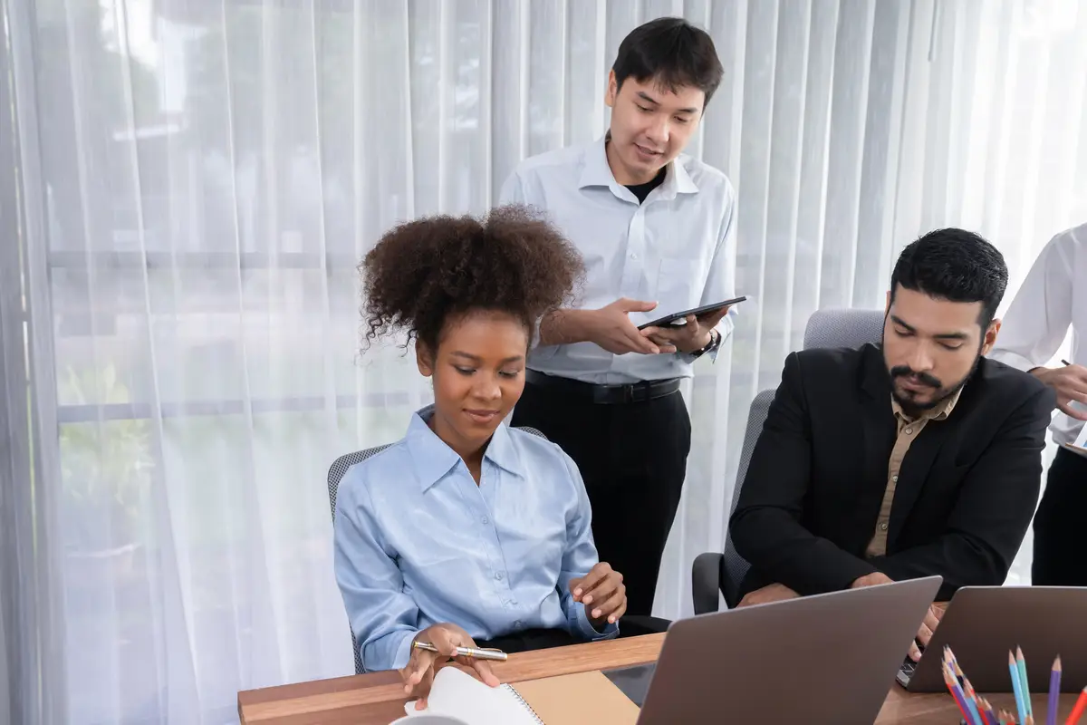 Modern multicultural office worker in corporate workplace Concord