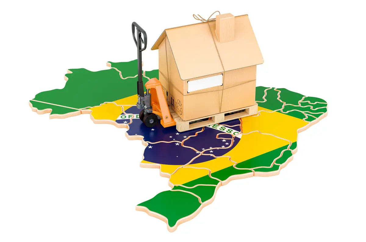 Residential moving service in Brazil concept Hydraulic hand pallet truck with cardboard house parcel on Brazilian map 3D rendering