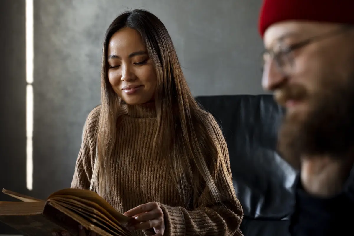 Side view smiley  people at book club