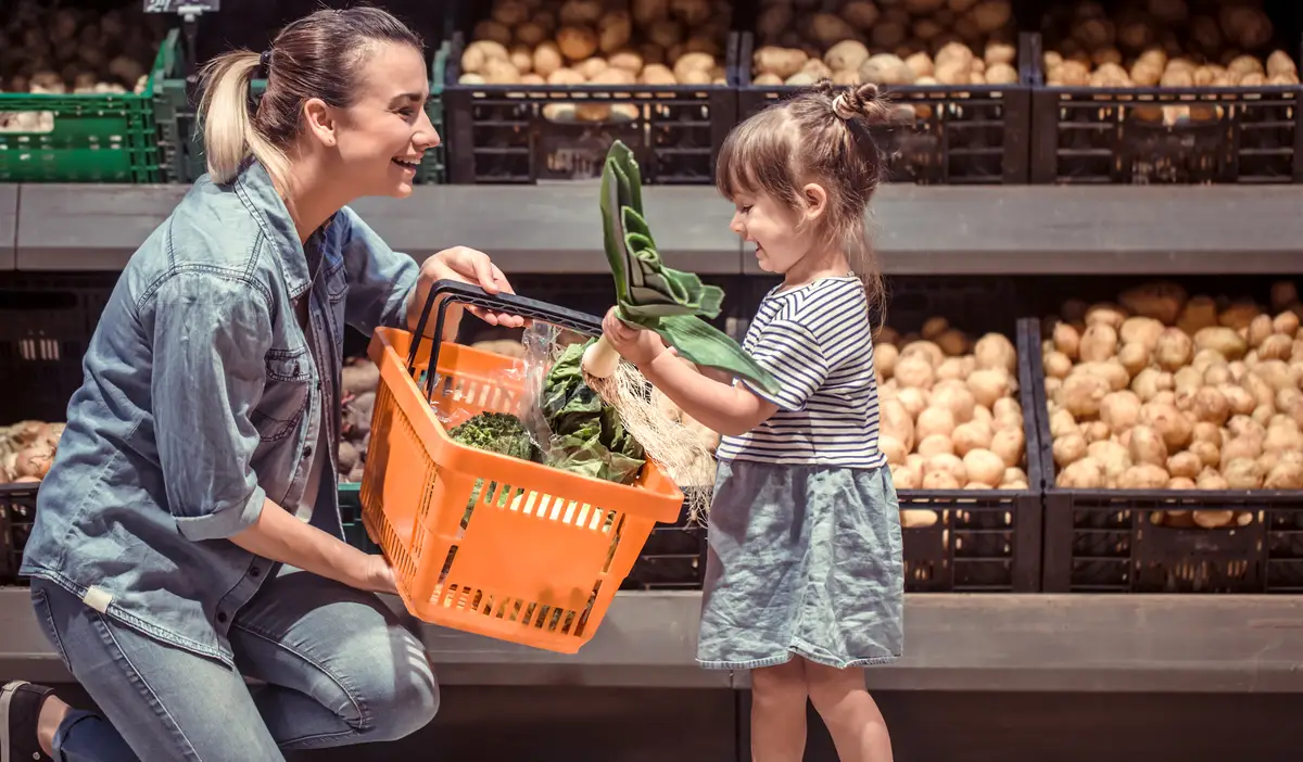 Mom and daughter are shopping at the supermarket