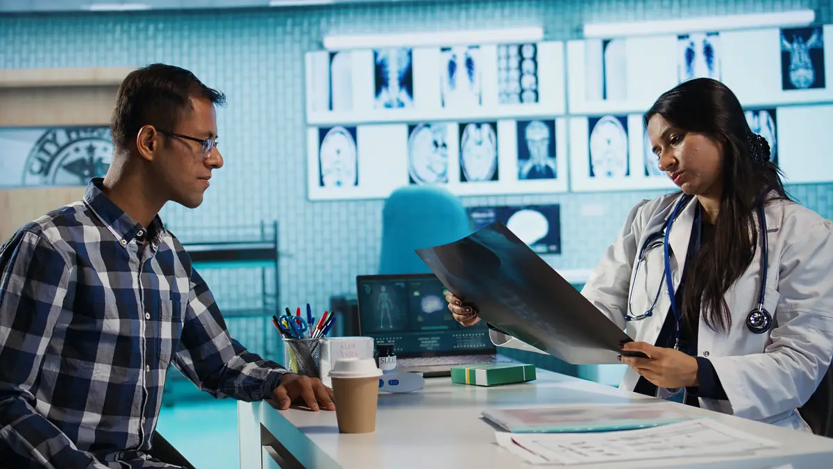 Indian general practitioner and patient engage in a medical consultation