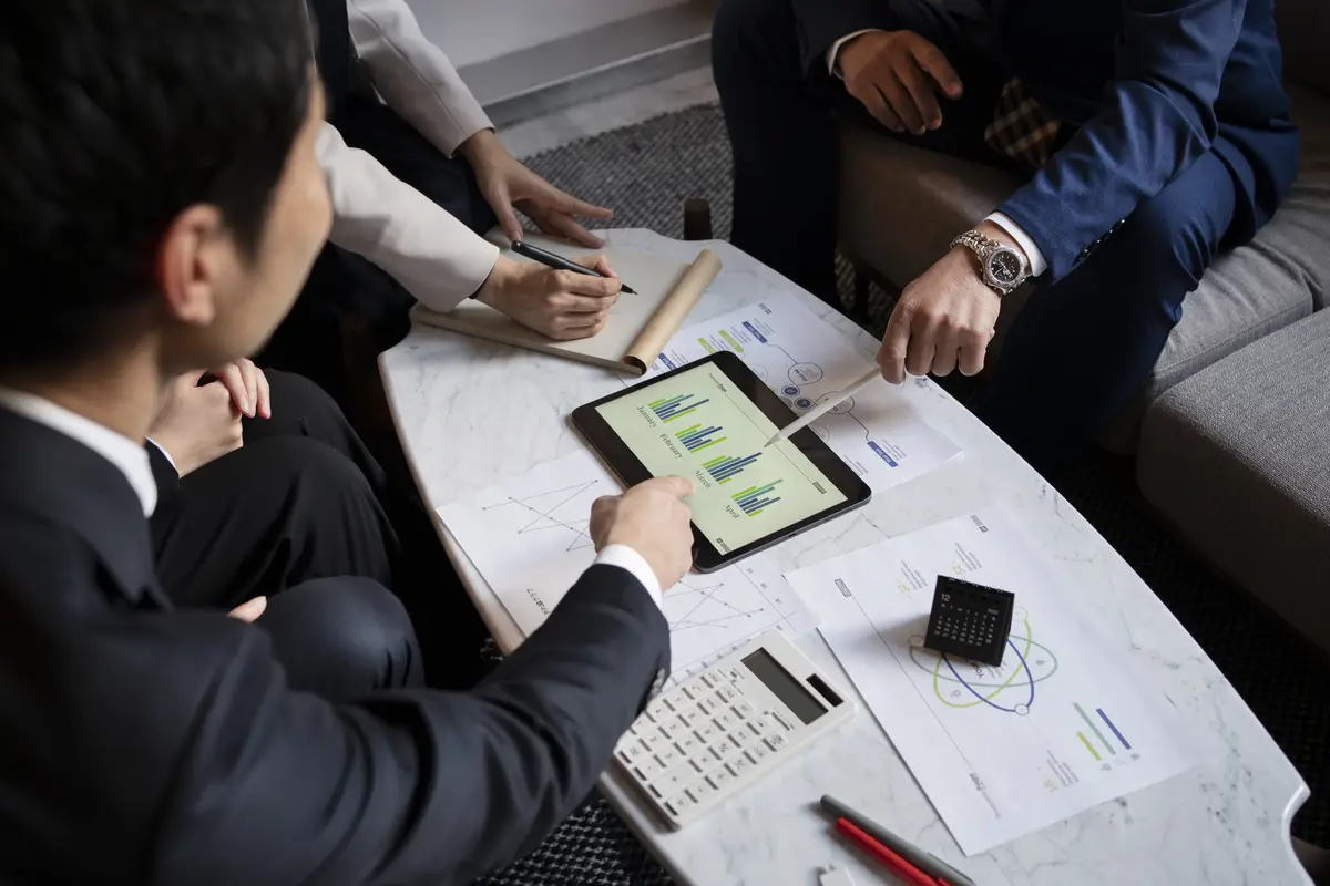 Business people working with ipad high angle