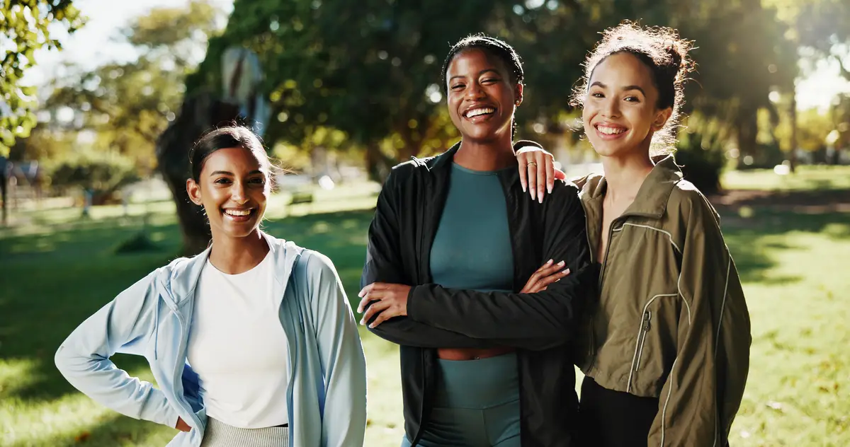 Portrait women or athlete friends in park on break in outdoor training workout or support in morning Proud girls confidence or happy people with smile for fitness teamwork or exercise in nature
