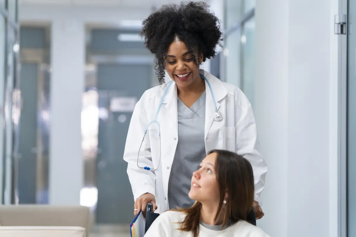 Front view smiley female doctor and patient