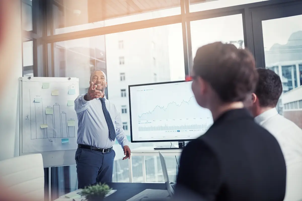 Presentation question and speaker pointing in a meeting for a report or corporate workshop in startup company Board manager and business man or mentor talking about growth or development strategy