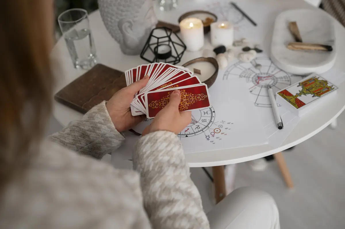 High angle woman reading tarot at home