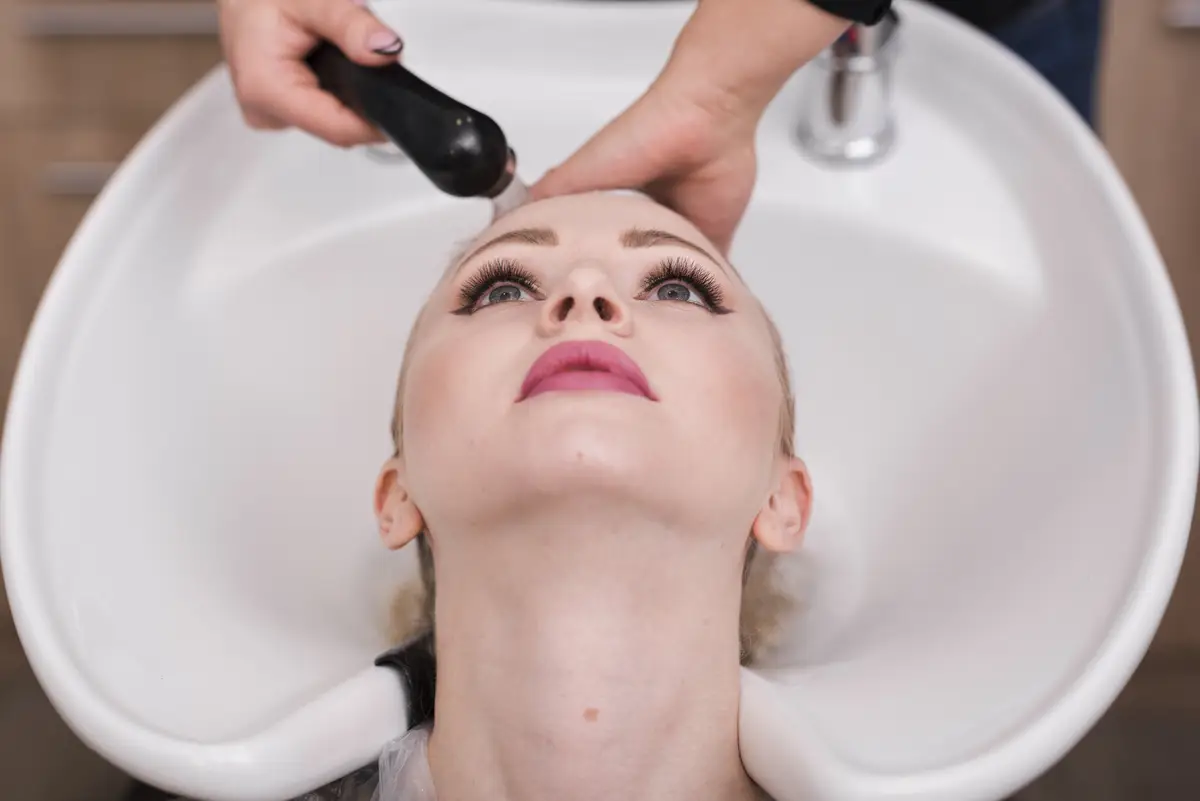 Blonde girl getting her hair done