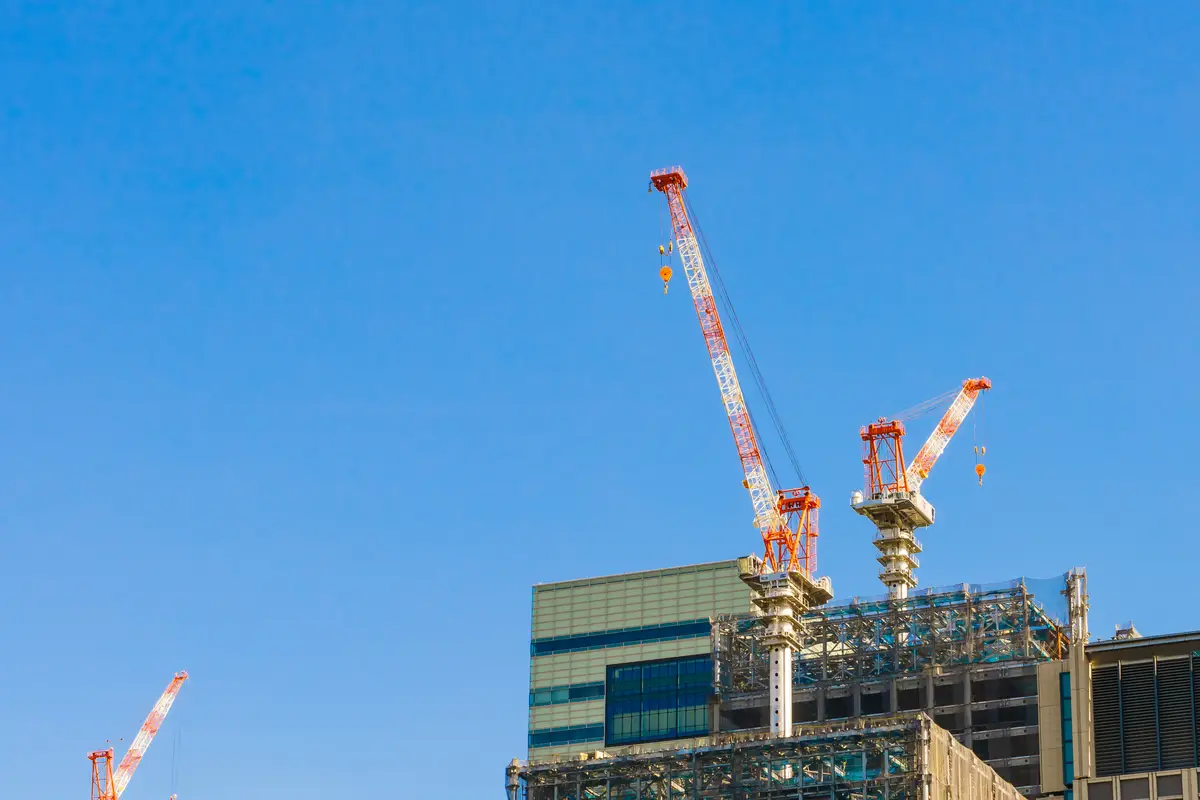 Crane and building construction site