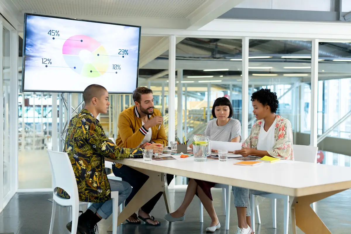 Business people discussing over documents in the conference room
