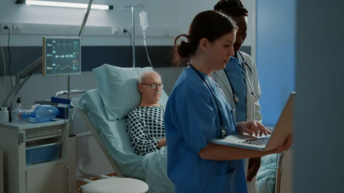 Multi ethnic hospital staff looking at medical tests