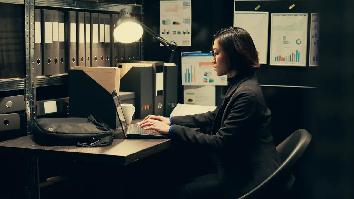 Detective uses forensic techniques to examine evidence stored in the archive