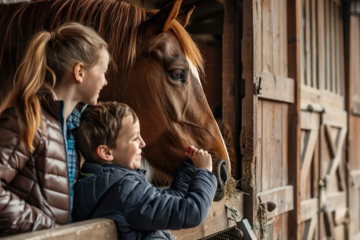 Happy family feeding a horse in the stable