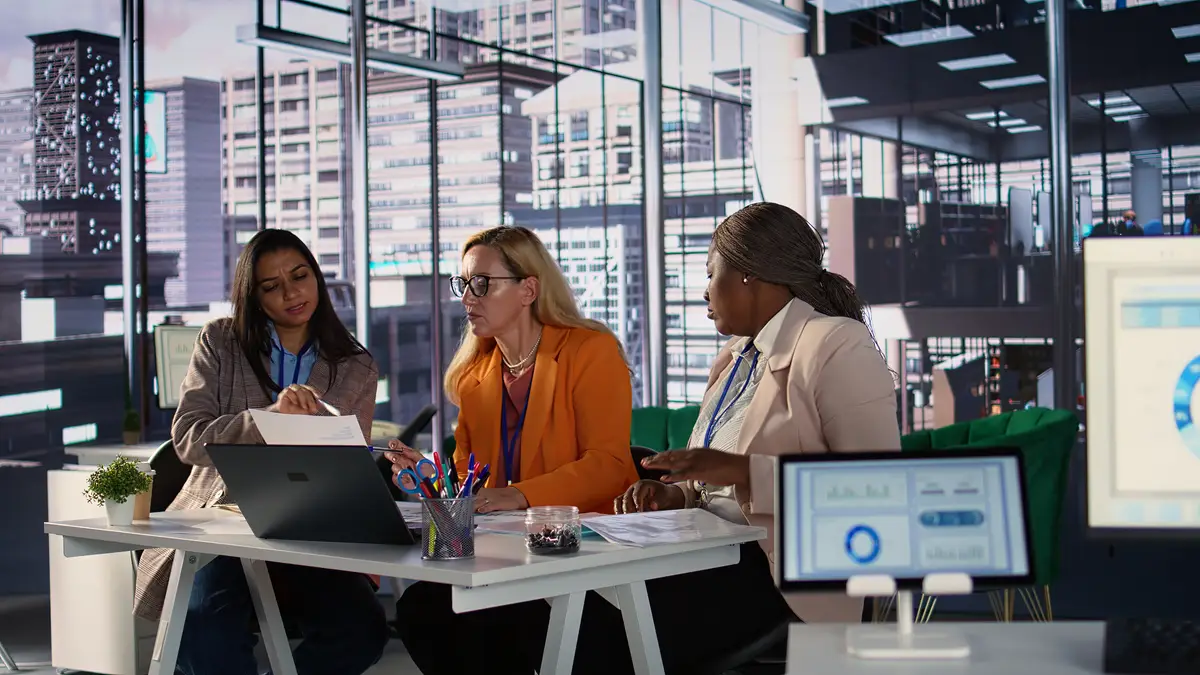 Diverse women leaders in a corporate meeting driving business growth