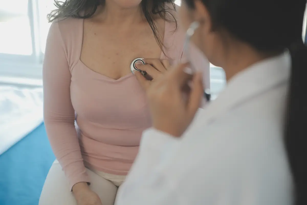Male patient having consultation with doctor or psychiatrist who working on diagnostic examination on men's health disease or mental illness in medical clinic or hospital mental health service center