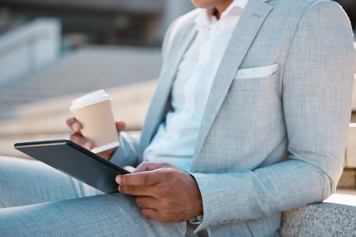 Black man business and tablet with coffee for marketing strategy planning sale growth or social media outdoor Male digital device for analytics or entrepreneur relax or browse online for research