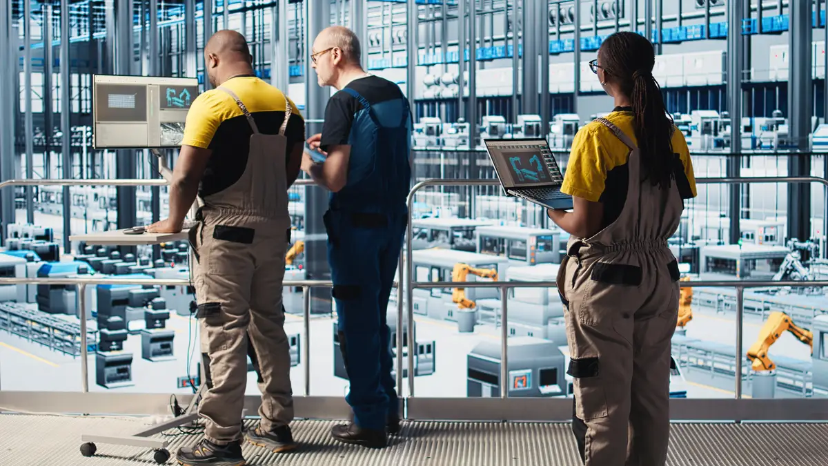 Engineers in industry 40 industrial plant controlling automated machinery