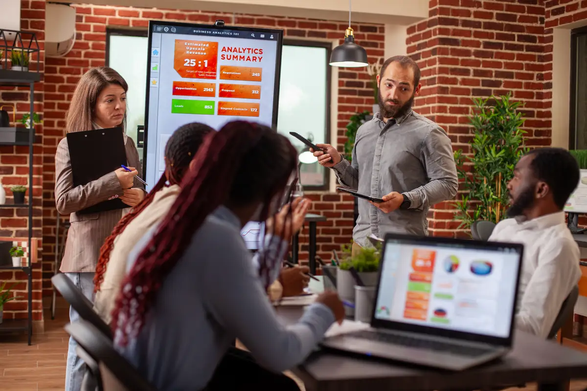 Business team analyzing digital data