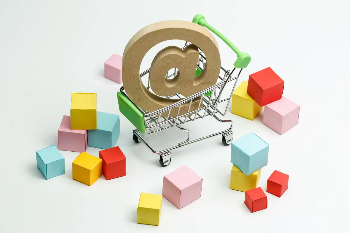 wooden symbol @ in shopping cart, Online shopping concept