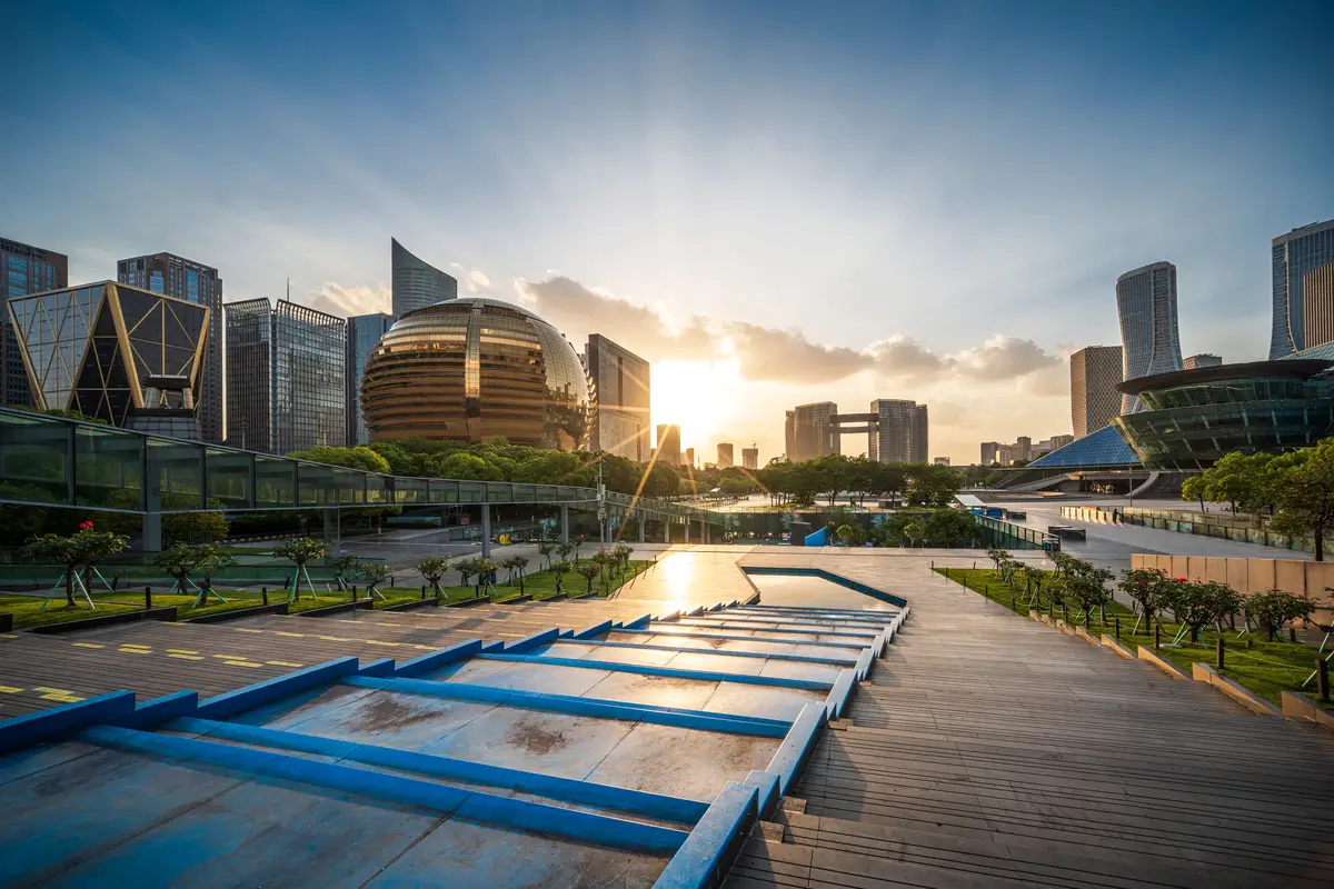 Stunning Sunset Over a Modern City Skyline with Vibrant Colors and Unique Architecture