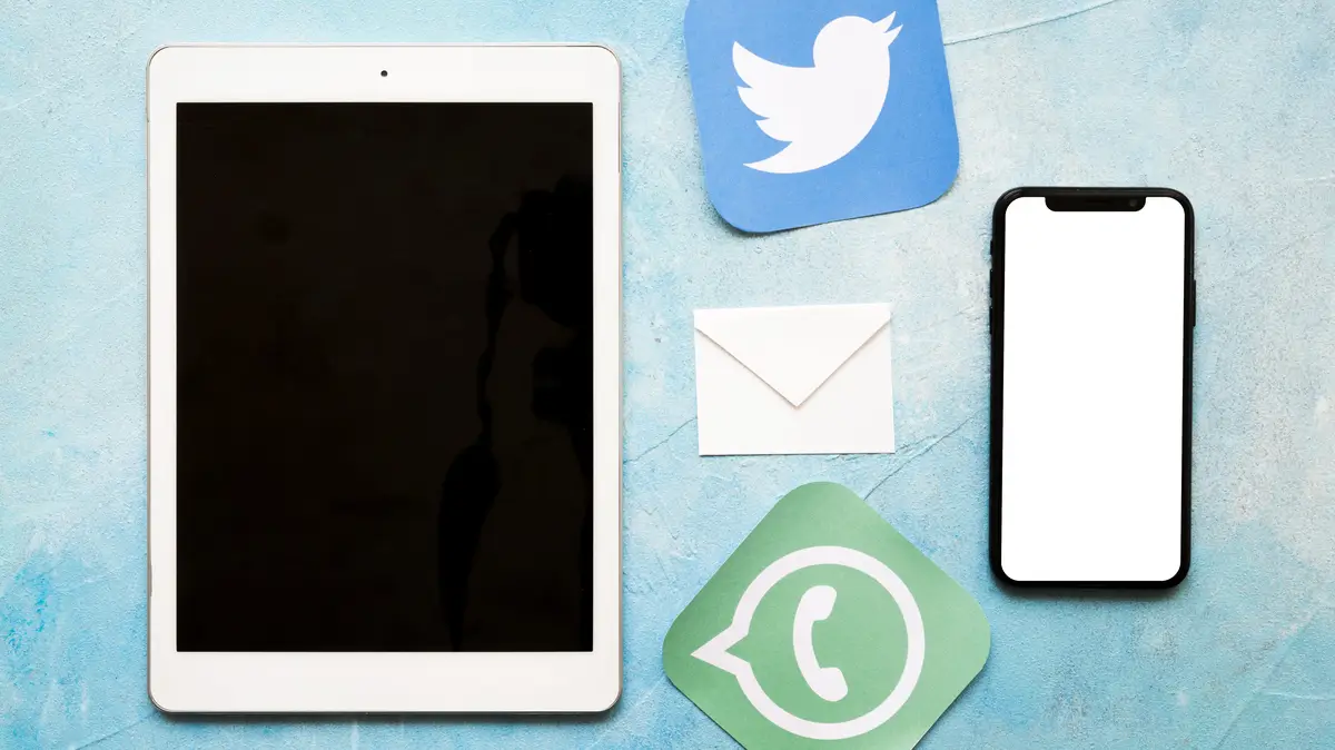 Social media icons with cellphone and digital tablet on blue painted texture background