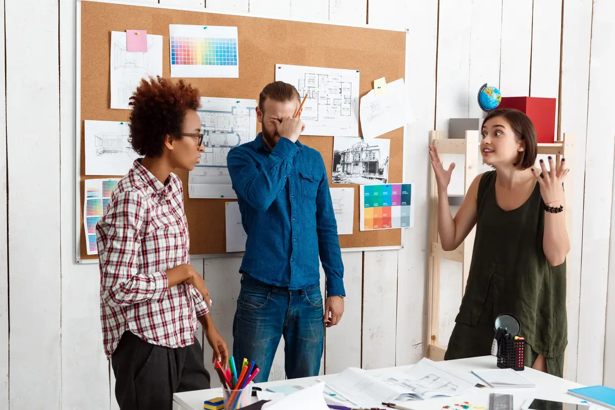 Colleagues argueing,  discussing drawings, new ideas in office