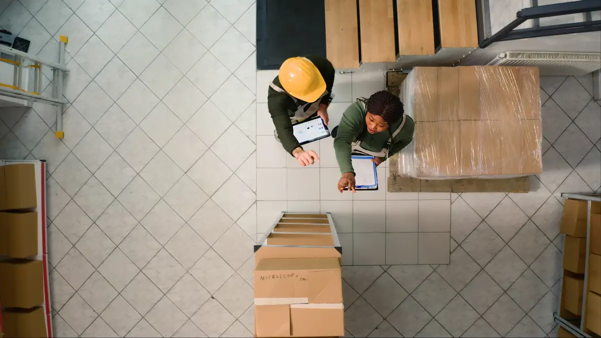 Warehouse employees inspecting
