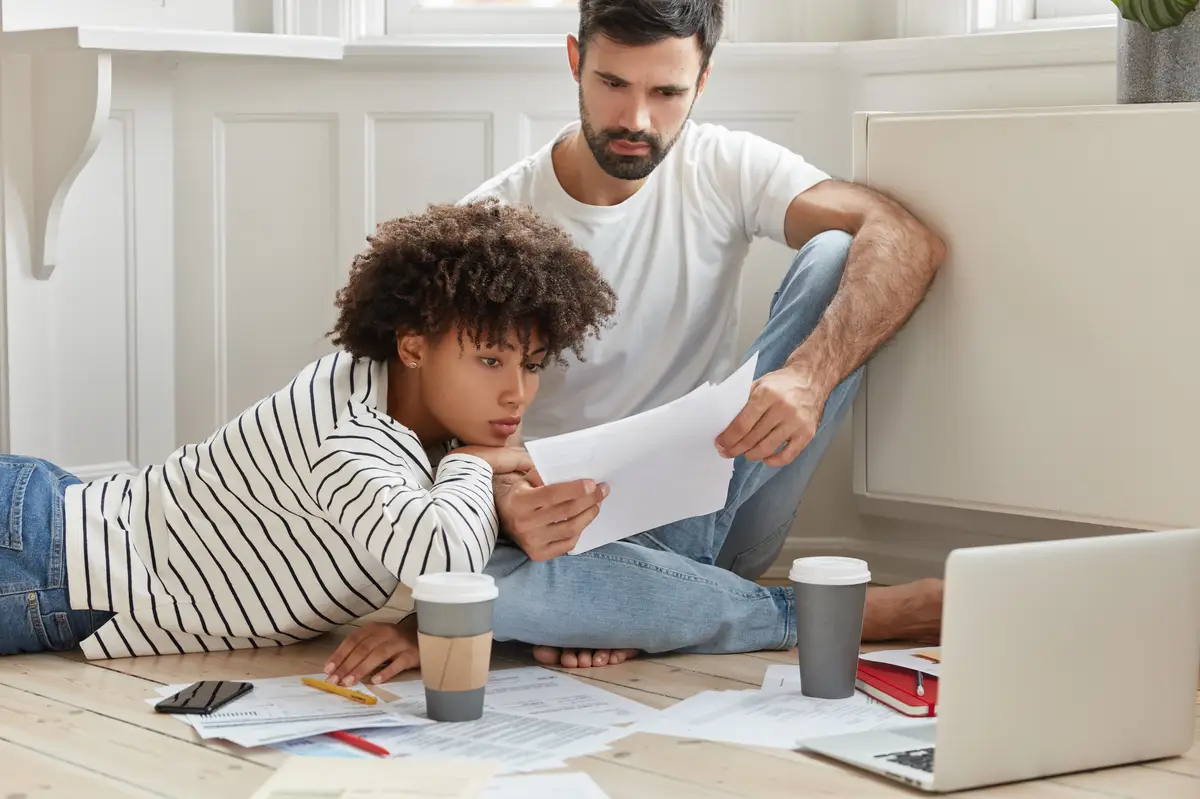 Multiracial student fill in questionnaire, study documents for school registration