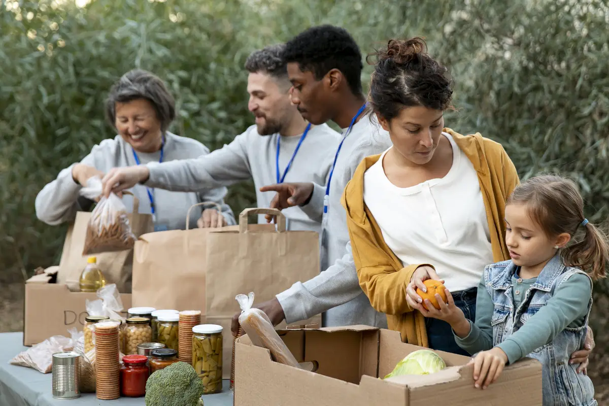 Volunteers collecting food donations medium shot
