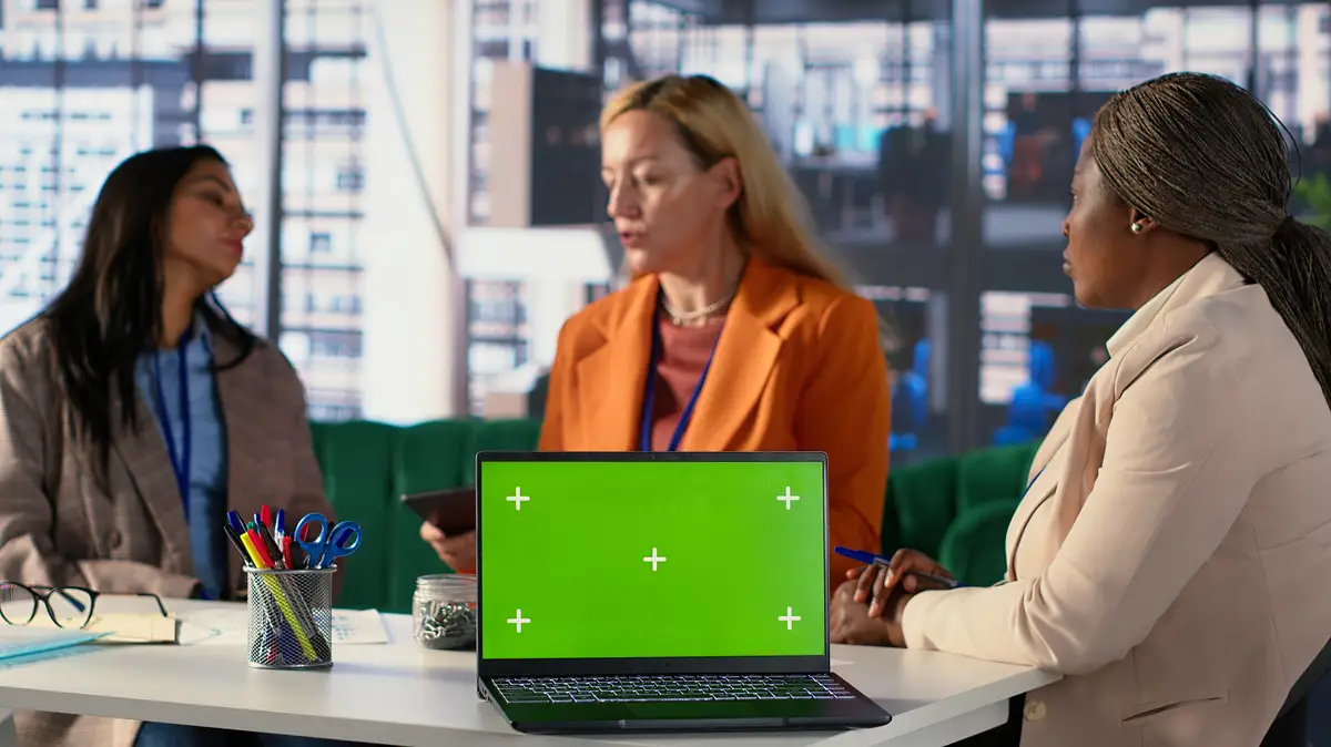 Multicultural team of specialists using mockup copy space in the office
