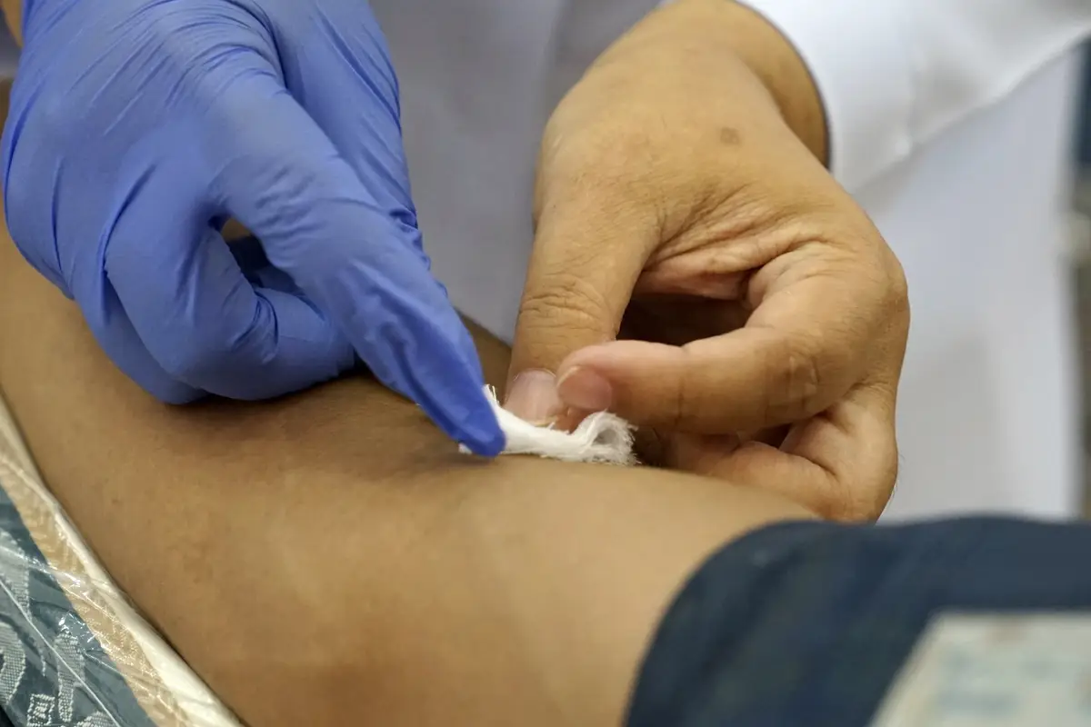 Close-up of doctor giving treatment to patient