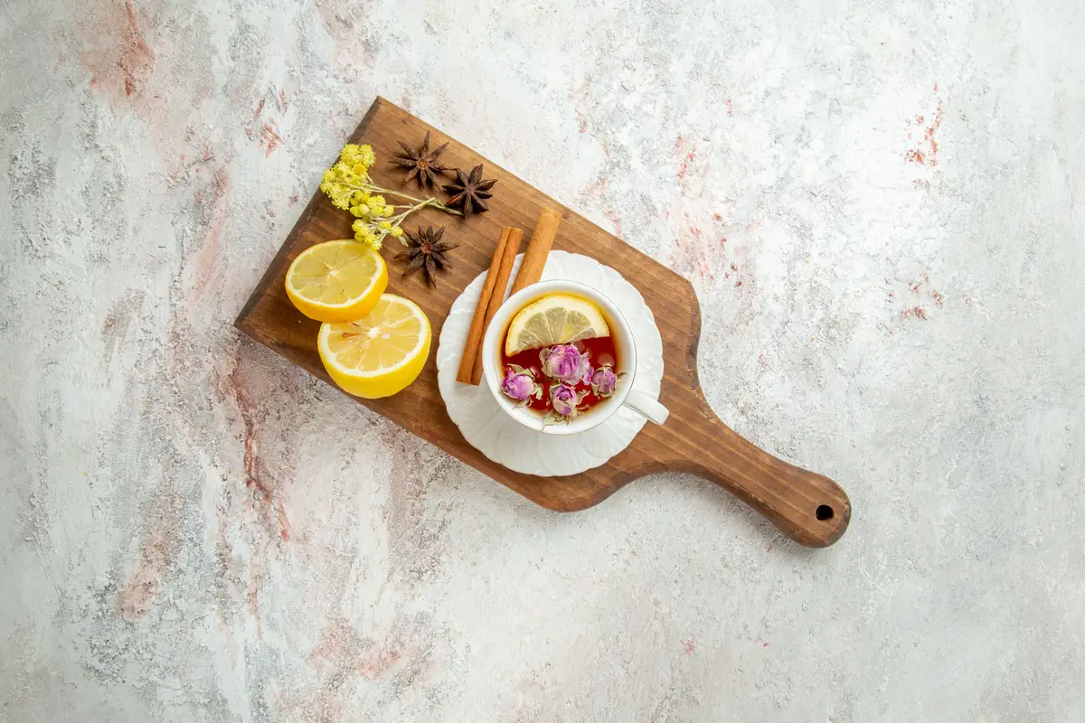 Top view cup of tea with lemon slices on a white background tea drink citrus fruit