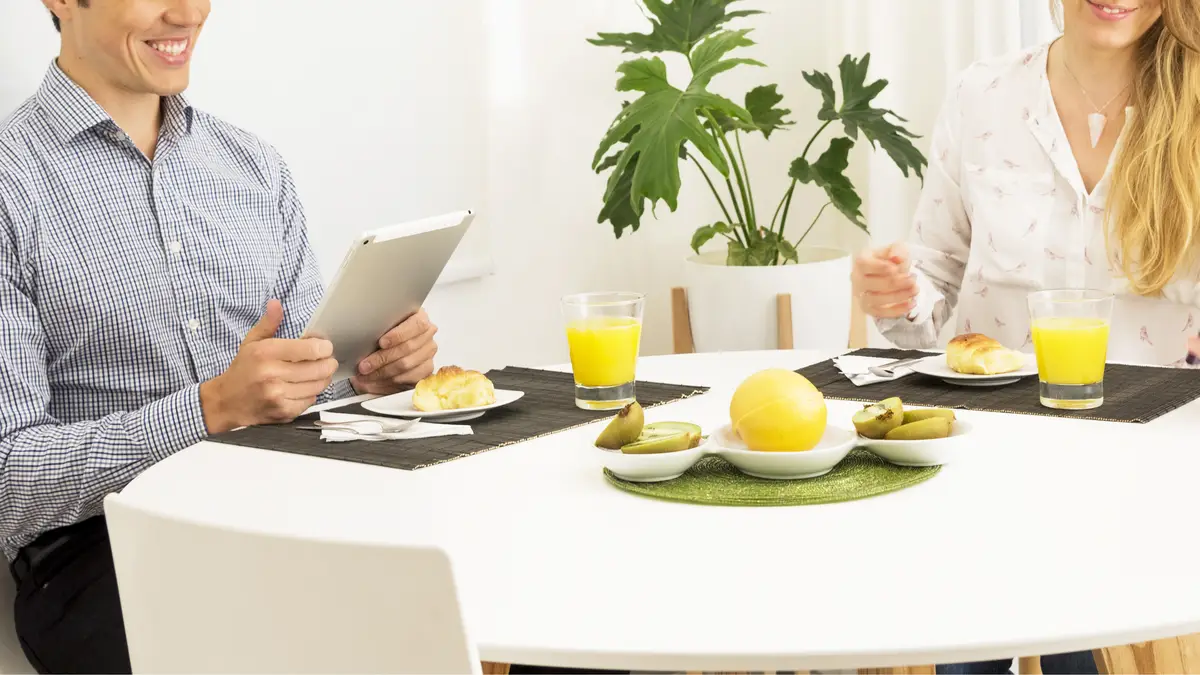 Couple sitting on breakfast table