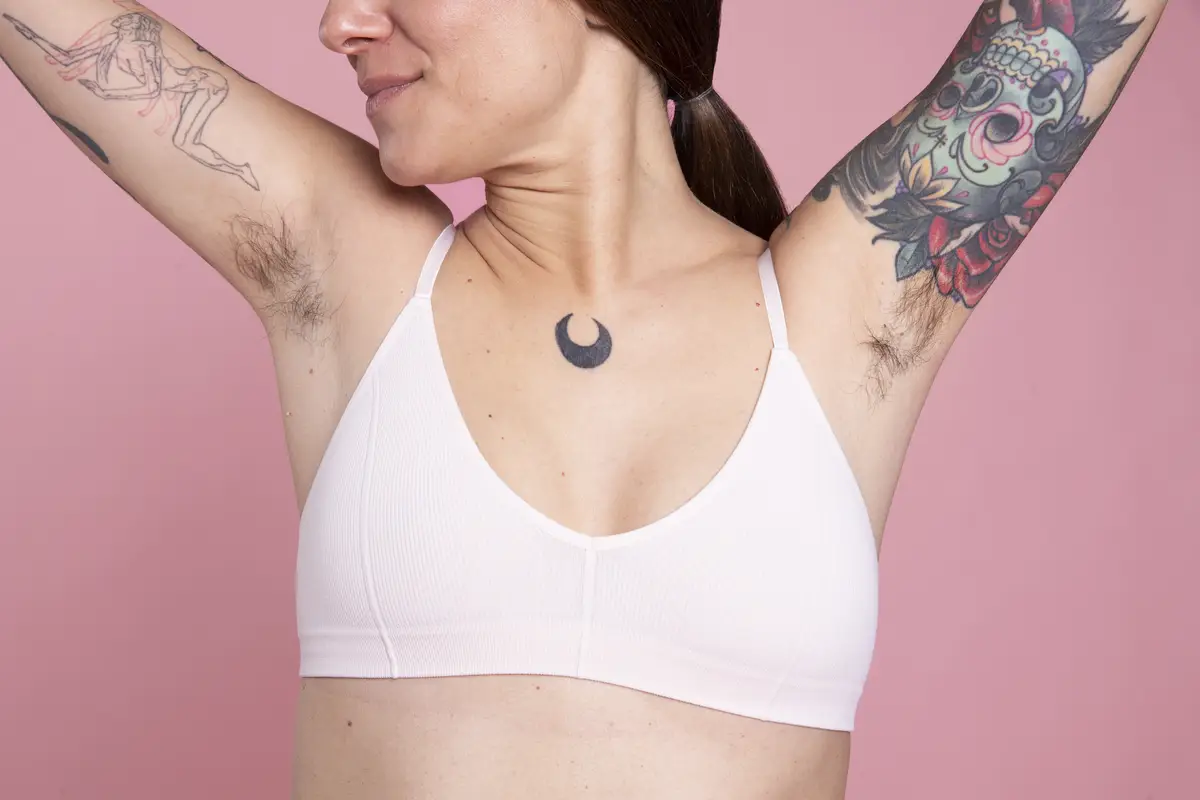 Woman holding her arms up studio portrait