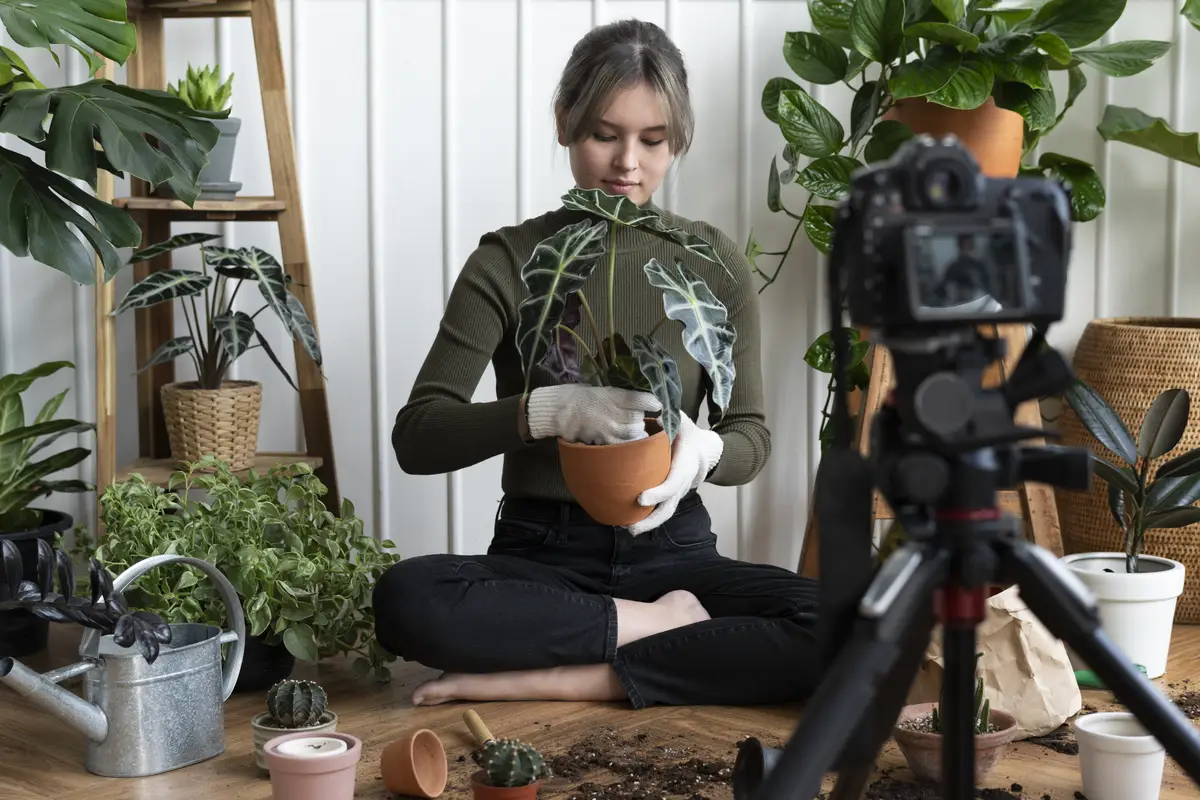 Plant blogger filming a video of herself planting