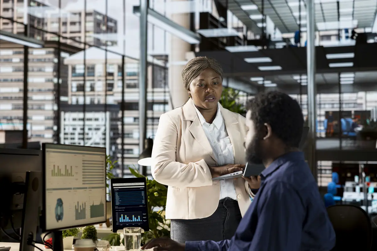 Businesswoman analyzing performance metrics on her computer at the workplace
