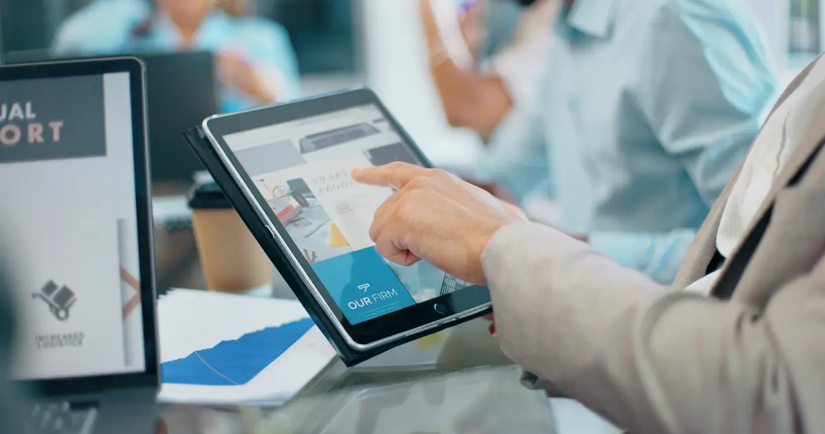 Businessman hands and tablet in digital marketing for corporate planning strategy or web design at the office Hand of executive testing website in discussion for idea UX or homepage in boardroom