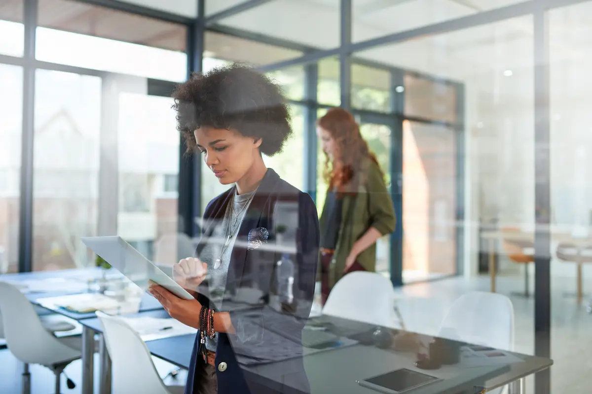 African business woman tablet and coworking space for web project career or review online email on digital report Professional female person or editor with tech for internet research and planning