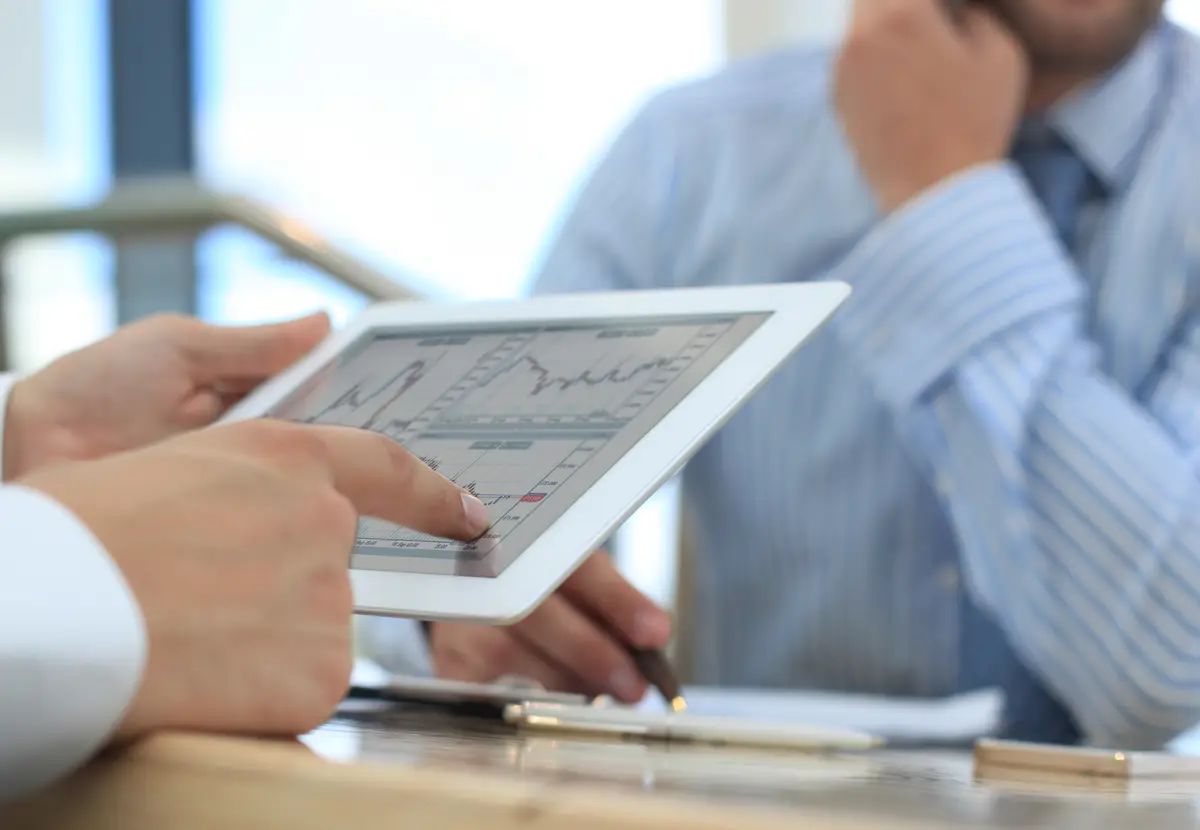 Business adviser analyzing financial figures denoting the progress in the work of the company