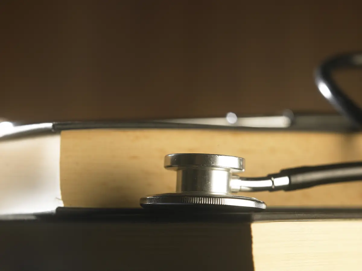 Close-up of stethoscope on top of book