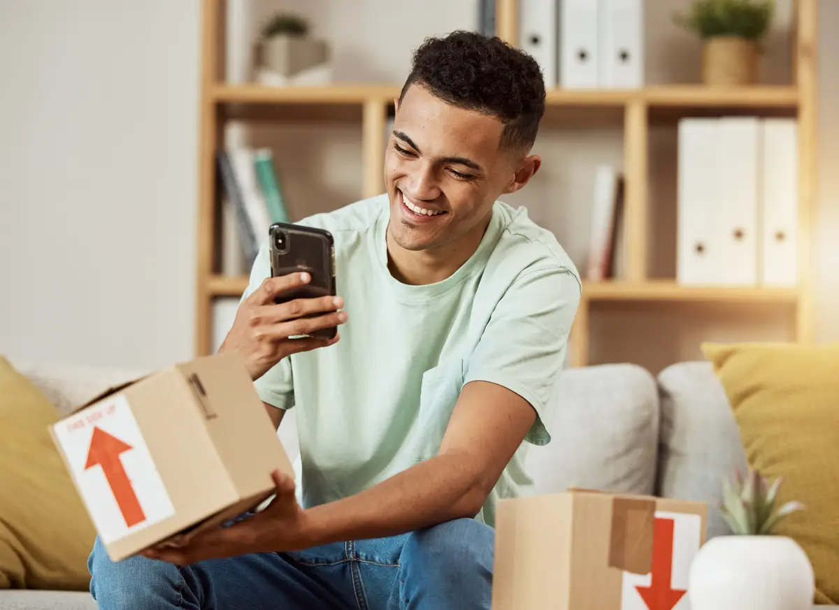 Ecommerce unboxing and man with phone as social media influencer marketing service or mobile app delivery Online website and person purchase gift in box on internet and advertising in home