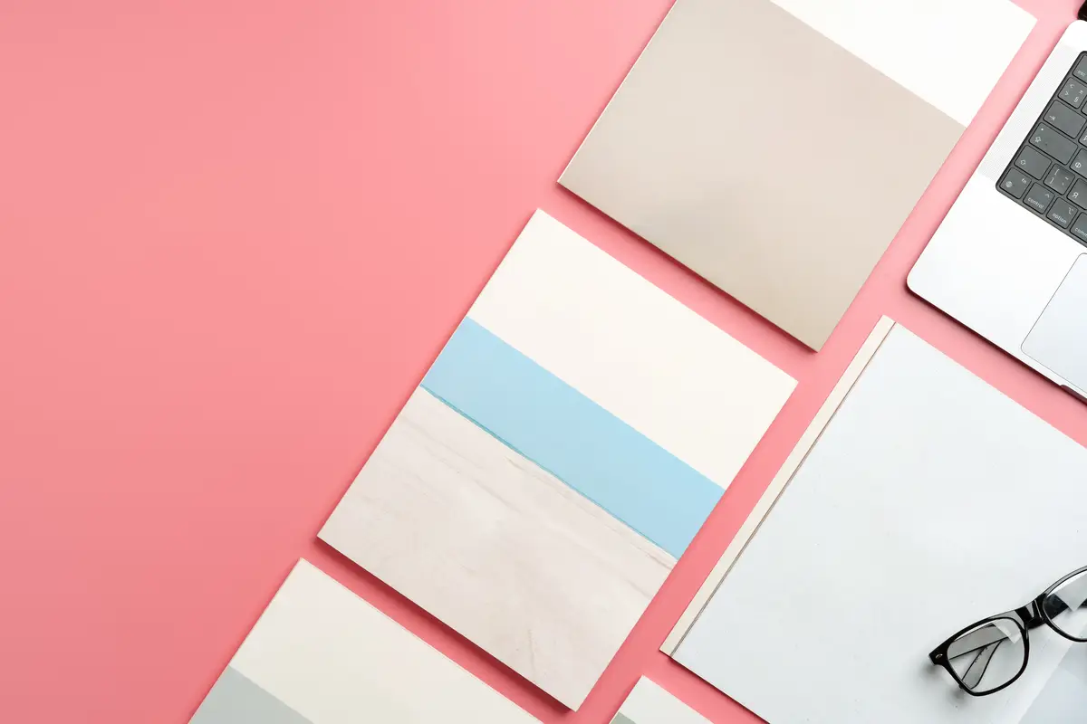 A Collection of Blank Papers Stacked on a Pink Surface for Creative Projects